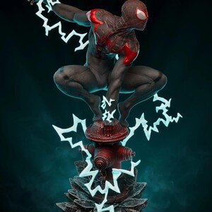 May include: A detailed statue of a superhero in a dynamic pose, crouched atop a red fire hydrant. The figure is clad in a black and red suit, with white lightning bolt effects emanating from the hands and feet. The base is a dark, textured surface.