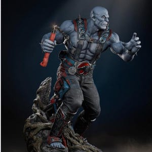 May include: A detailed statue of a muscular, blue-skinned humanoid figure holding a red weapon with a chain. The figure is wearing a harness, belt, and pants with red and blue accents. The statue is posed on a rocky base.