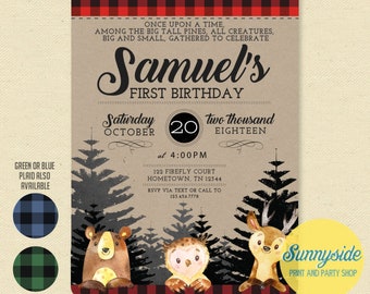 May include: A woodland-themed first birthday invitation for a boy named Samuel. The invitation features a red and black plaid background, a brown paper texture, and illustrations of a bear, owl, and deer in a forest setting. The text reads "Samuel's First Birthday" and includes the date, time, and location of the party.