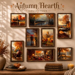 May include: A gallery wall display titled Autumn Hearth Collection featuring eight framed landscape paintings depicting autumn scenes, including a bridge, a church, and a cozy interior, arranged above a table with pumpkins and books.