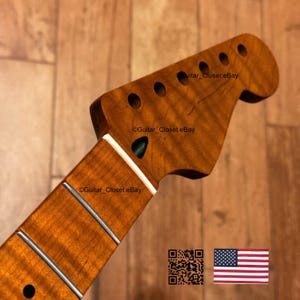 Op de afbeelding: Close-up van een gitaarhals en kop van hout. De kop heeft zes gaten voor de stemknoppen. De toets heeft zilveren frets. Het hout heeft een warme, roodbruine kleur. De tekst "Guitar Closet eBay" is zichtbaar.