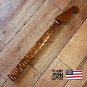 May include: A guitar neck with a natural wood finish, featuring frets and tuning peg holes. The headstock is shaped with a rounded end. The image includes the text "Guitar_Closet eBay" and a QR code, along with a small American flag.