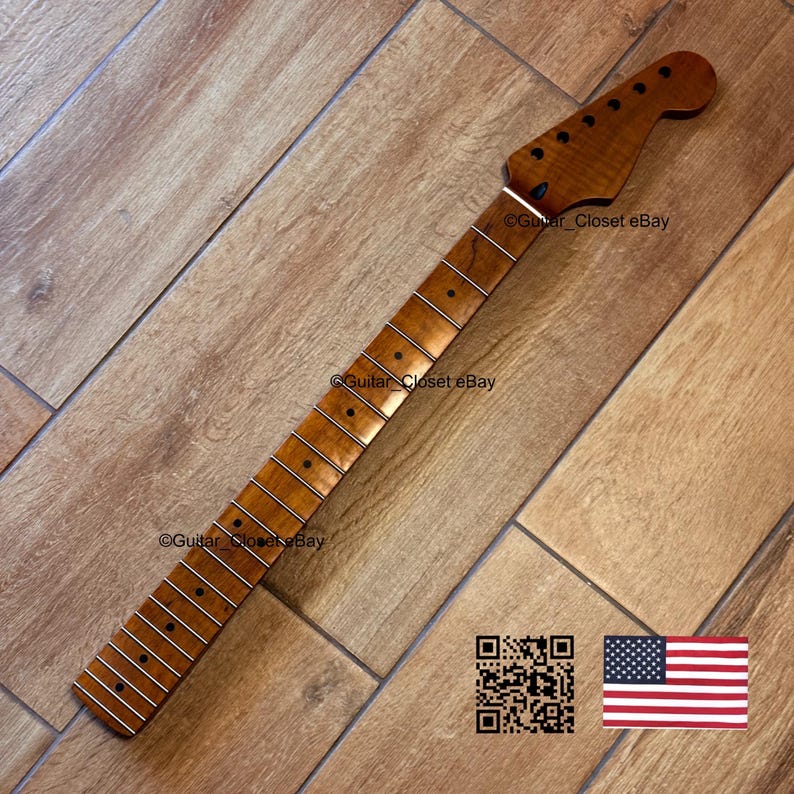 May include: A guitar neck with a natural wood finish, featuring frets and tuning peg holes. The headstock is shaped with a rounded end. The image includes the text "Guitar_Closet eBay" and a QR code, along with a small American flag.