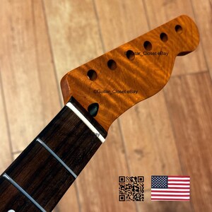 Puede incluir: Primer plano del m&aacute;stil y la pala de una guitarra. La pala es de color marr&oacute;n claro con seis agujeros para las clavijas. El diapas&oacute;n es marr&oacute;n oscuro con marcadores de traste blancos. El texto "Guitar Closet eBay" es visible.