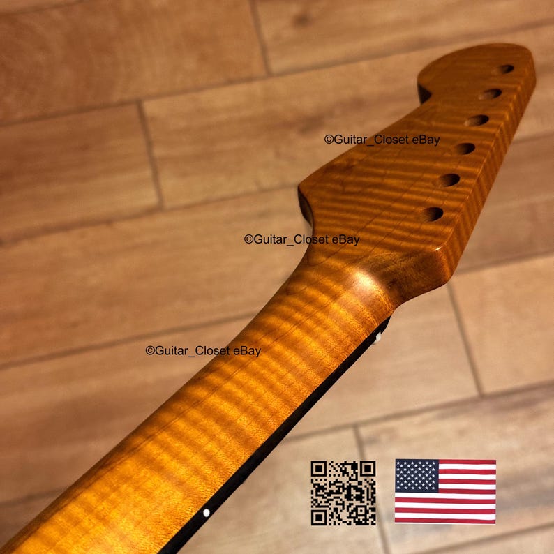 May include: A close-up of a guitar neck with a flamed maple finish. The headstock has six tuning peg holes. The text "Guitar_Closet eBay" is visible. An American flag and a QR code are in the lower right corner.