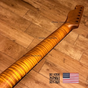 May include: A close-up of a guitar neck with a flamed maple finish. The wood grain has a wavy pattern with shades of amber and brown. The headstock has tuning peg holes. The image includes the text "Guitar Closet eBay" and a QR code and American flag.