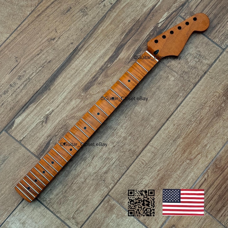 May include: A guitar neck with a natural wood finish. The neck features a headstock with tuning peg holes, a fretboard with inlaid markers, and metal frets. The wood grain is visible. The text "Guitar Closet eBay" is visible.