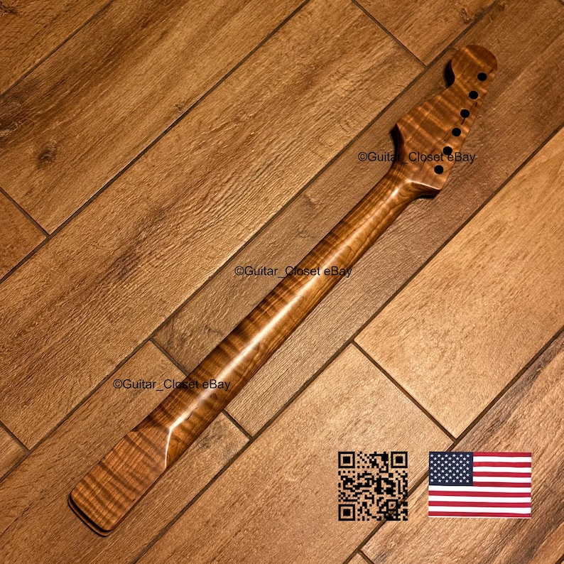 K&ouml;nnte beinhalten: Ein Gitarrenhals mit einer nat&uuml;rlichen braunen Oberfl&auml;che und einer sichtbaren Tigerstreifen-Maserung aus geflammtem Ahornholz. Die Kopfplatte enth&auml;lt sechs vorgebohrte L&ouml;cher f&uuml;r Stimmwirbel. Der Text Guitar_Closet eBay ist sichtbar.