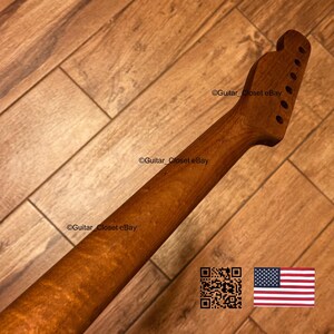 May include: A natural wood guitar neck featuring a prominent flame maple grain pattern, a smooth finish, and a headstock with six pre-drilled tuning peg holes. The text Guitar_Closet eBay is visible on the neck and headstock, alongside a QR code.
