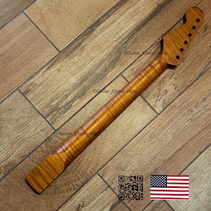 May include: A wooden guitar neck with a flamed maple finish. The neck has a headstock with six tuning peg holes and a smooth, polished surface. The wood grain is visible, and the neck is a warm, amber color. The text "Guitar Closet eBay" is visible.