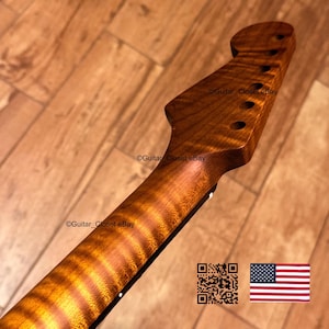 May include: A guitar neck featuring a natural wood finish with a prominent flame maple grain pattern. The headstock includes six pre-drilled tuner holes. The text Guitar_Closet eBay is visible on the wood surface, alongside a QR code and a US flag.