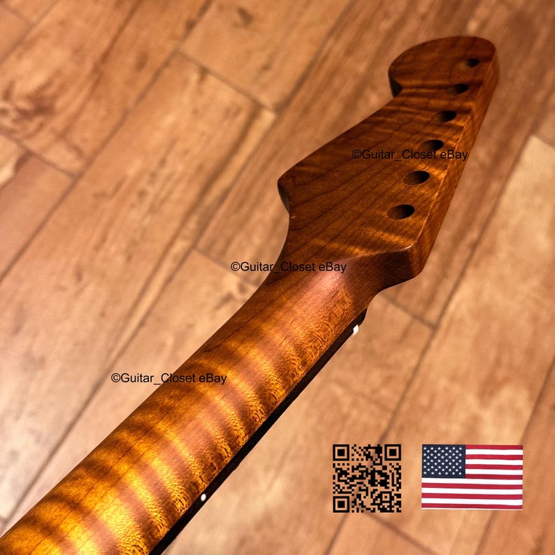 May include: A guitar neck featuring a natural wood finish with a prominent flame maple grain pattern. The headstock includes six pre-drilled tuner holes. The text Guitar_Closet eBay is visible on the wood surface, alongside a QR code and a US flag.