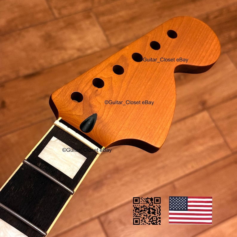 May include: A guitar neck with a natural wood finish. The headstock has six tuning peg holes and a black string tree. The fretboard is black with white inlays. The text "Guitar_Closet eBay" is visible on the headstock and fretboard.