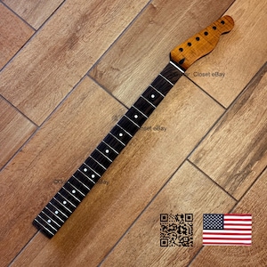 May include: A guitar neck with a dark fretboard and a light-colored headstock. The fretboard has white dot inlays. The headstock has tuning peg holes. The text "Guitar_Closet eBay" is visible. An American flag and a QR code are in the image.