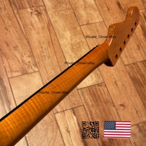 May include: A set of three ceramic mugs with a speckled, matte finish. The mugs are in shades of cream, light gray, and dark gray. Each mug has a simple, minimalist design and a rounded handle.