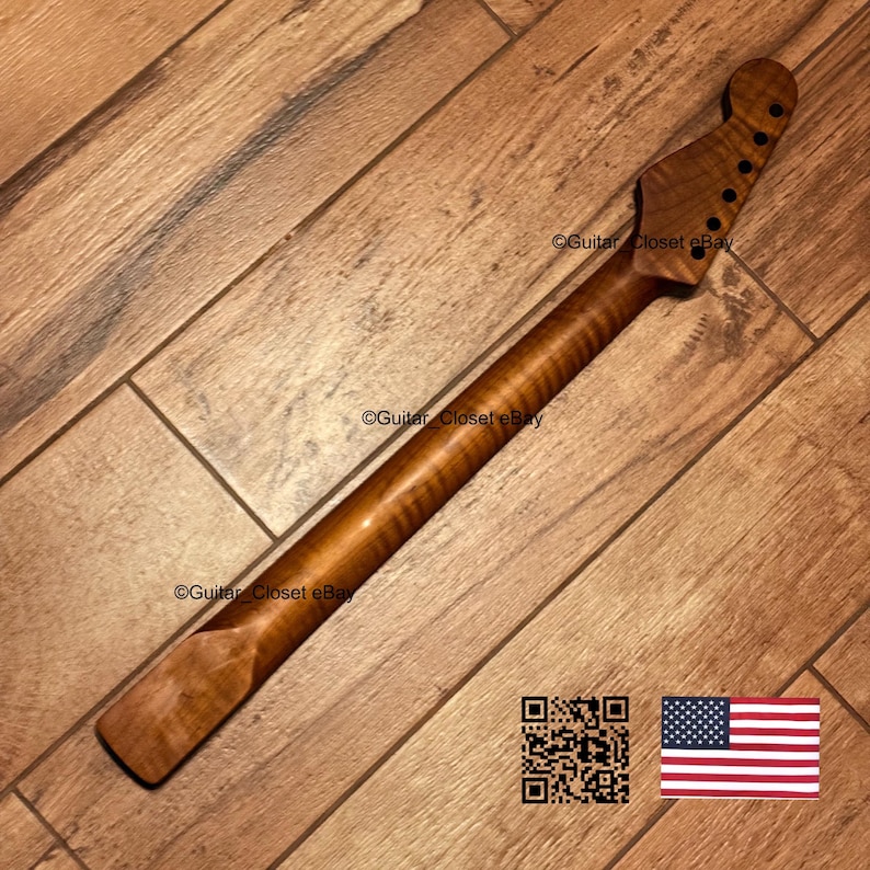 May include: A guitar neck crafted from brown flamed maple wood featuring a distinct tiger stripe grain pattern. The headstock includes six pre-drilled holes for tuning pegs. The text Guitar_Closet eBay is visible on the wood surface.