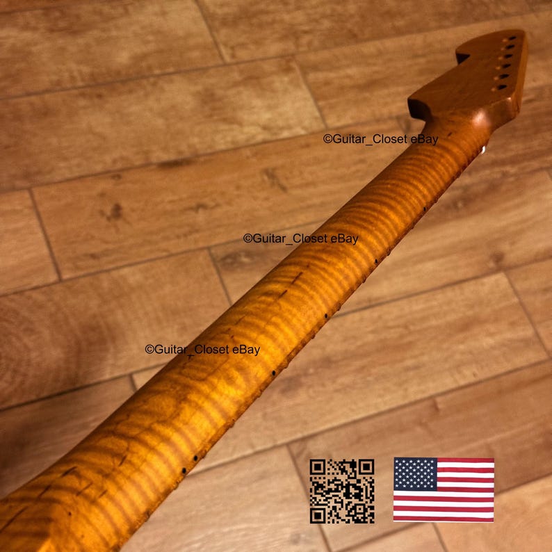 May include: A wooden guitar neck with a flamed maple grain pattern. The neck is a light brown colour and has a headstock with tuning peg holes. The image includes the text "Guitar_Closet eBay" and a QR code and American flag.