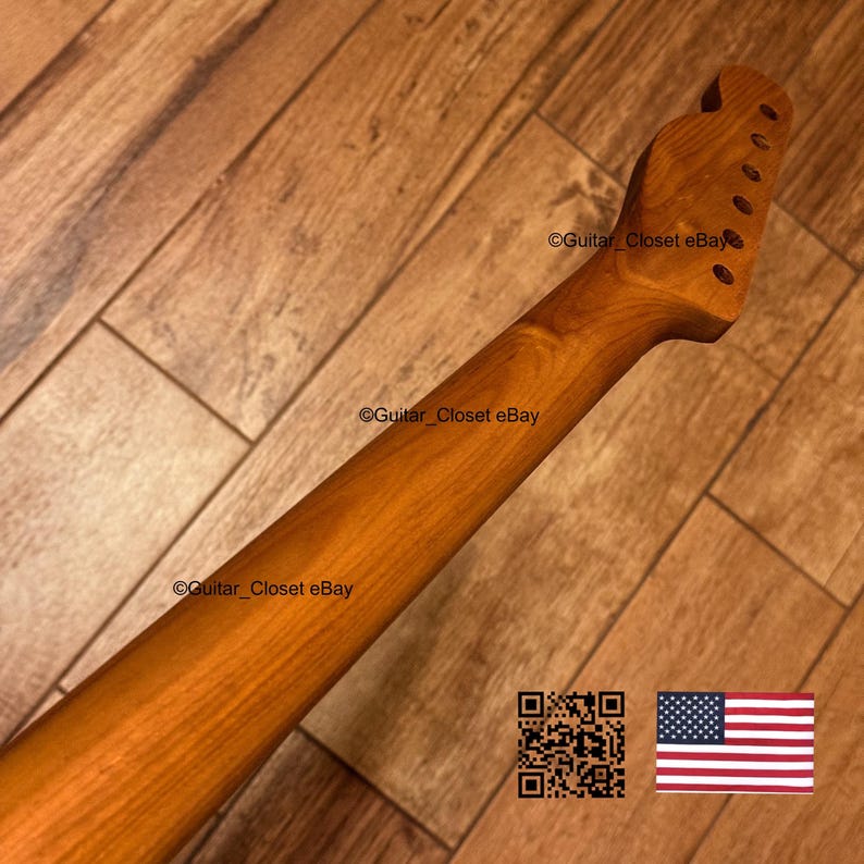 May include: A natural light brown wooden guitar neck featuring a headstock with six tuner holes. The wood grain is visible throughout the length of the neck. The text Guitar_Closet eBay is present on the surface, along with a QR code and a US flag.
