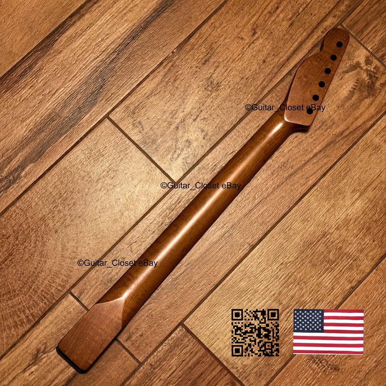 May include: A smooth, medium-brown wooden guitar neck featuring a headstock with six pre-drilled tuning peg holes. The neck has a natural wood grain finish and a flat heel base, designed for attachment to a guitar body. The surface is polished.