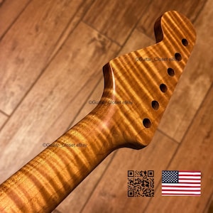 May include: A guitar neck with a headstock featuring a prominent tiger-stripe flame maple wood grain pattern. The headstock includes six pre-drilled tuning peg holes arranged in a single row. The text Guitar_Closet eBay appears on the wood.