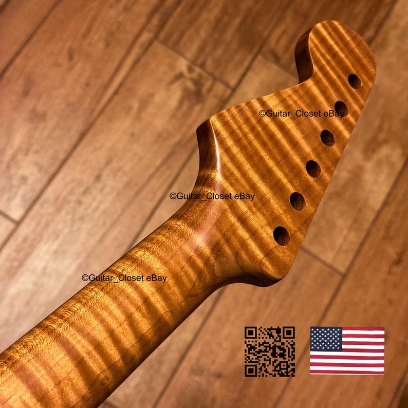 May include: A guitar neck with a headstock featuring a prominent tiger-stripe flame maple wood grain pattern. The headstock includes six pre-drilled tuning peg holes arranged in a single row. The text Guitar_Closet eBay appears on the wood.