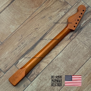 May include: A new, unfinished guitar neck made of light brown wood. The neck has a headstock with pre-drilled holes for tuning pegs and a smooth, long shaft. The image includes a QR code and a small American flag.