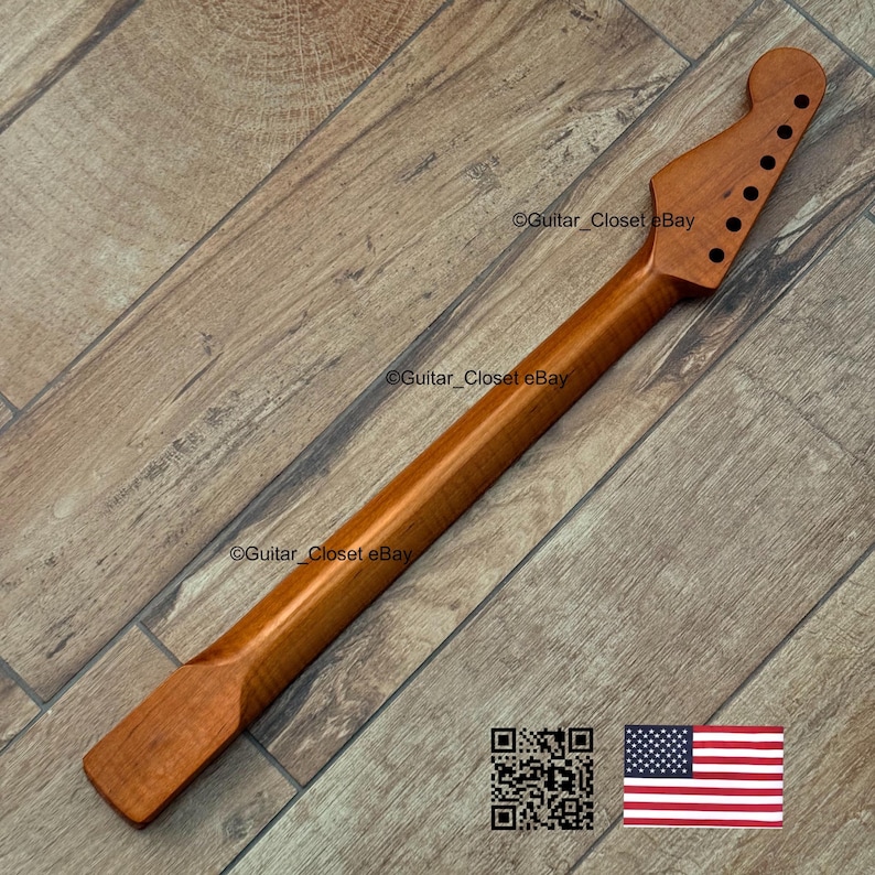May include: A new, unfinished guitar neck made of light brown wood. The neck has a headstock with pre-drilled holes for tuning pegs and a smooth, long shaft. The image includes a QR code and a small American flag.