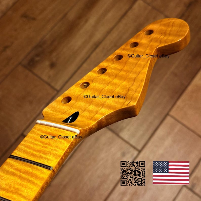 May include: A close-up of a guitar neck and headstock with a flamed maple finish. The headstock has six tuning peg holes. The fretboard has black lines. The text "Guitar_Closet eBay" is visible. A QR code and the American flag are in the image.