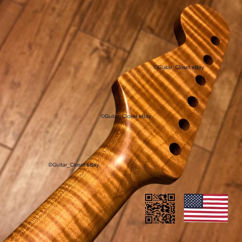 May include: A guitar neck featuring a headstock with six tuner holes, crafted from light brown wood with a prominent tiger-stripe flame maple grain pattern. The text Guitar_Closet eBay is visible on the wood surface, alongside a QR code and a US flag.