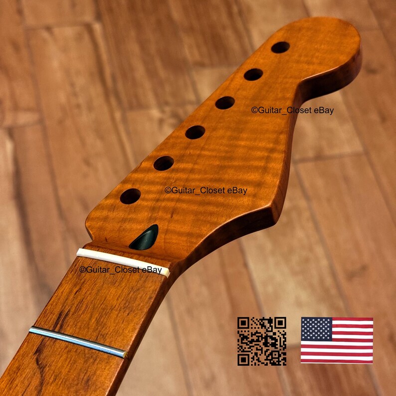 May include: A close-up of a guitar neck with a natural wood finish. The headstock has six tuning peg holes and a curved shape. The neck has a white fretboard and a silver string. The text "Guitar_Closet eBay" is visible.