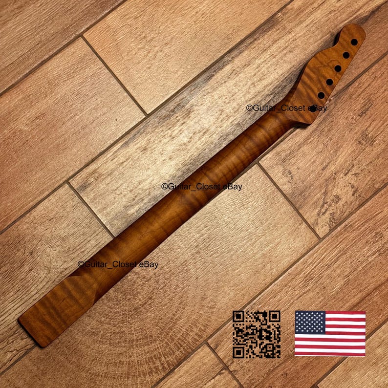 May include: A guitar neck made of wood with a dark brown finish. The neck has a headstock with six tuning peg holes and a fretboard. The wood grain is visible. The image also includes a QR code and a US flag.