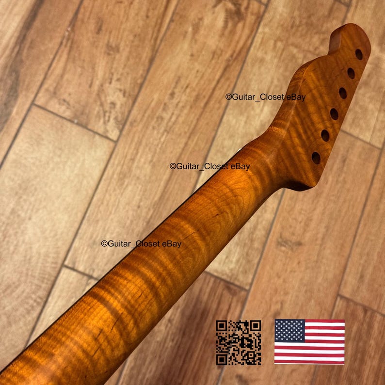 Puede incluir: Un m&aacute;stil de guitarra con acabado de arce flameado. El m&aacute;stil es de color &aacute;mbar c&aacute;lido con patrones de vetas de madera visibles. El clavijero tiene agujeros preperforados para las clavijas. La imagen incluye el texto "Guitar_Closet eBay" y un c&oacute;digo QR.