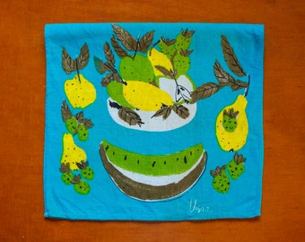 May include: A blue tea towel with a colorful illustration of fruit, including pears, watermelon, and strawberries. The design is in a retro style with a hand-drawn look. The towel is signed "Uzita".