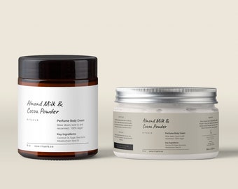 May include: Two brown glass jars with white labels. The labels read "Almond Milk & Cocoa Powder" and "Perfume Body Cream". The jars are on a light beige background.