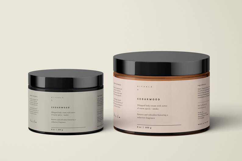 May include: Two jars of Cedarwood whipped body cream with black lids. The jars have a light brown label with the product name and description. The smaller jar contains 6 oz / 170 g, and the larger jar contains 8 oz / 200 g.