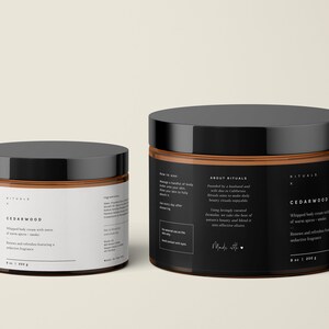 May include: Two jars of Cedarwood whipped body cream with black lids and labels. The labels include text about the product and its ingredients. The larger jar contains 8 oz / 226 g of cream.