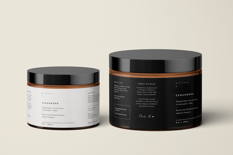 May include: Two jars of Cedarwood whipped body cream with black lids and labels. The labels include text about the product and its ingredients. The larger jar contains 8 oz / 226 g of cream.