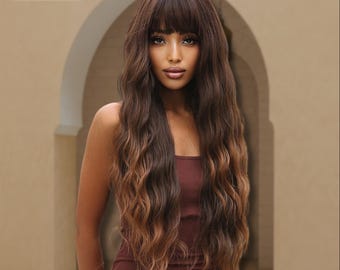 May include: A long, wavy wig with a dark brown base and caramel highlights. The wig features a full fringe and is labeled "wig THALEYA" in the upper left corner. The model is wearing a burgundy dress.