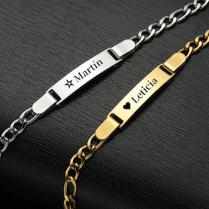 Può includere: Due braccialetti personalizzati. Uno è argentato con il nome "Martín" e una stella. L'altro è dorato con il nome "Leticia" e un simbolo a cuore. Entrambi i braccialetti hanno un design a catena.