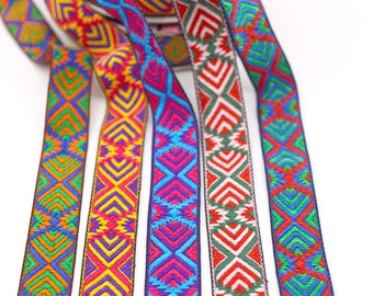 May include: Five colorful woven ribbon trims with geometric patterns in shades of green, blue, red, yellow, and purple.