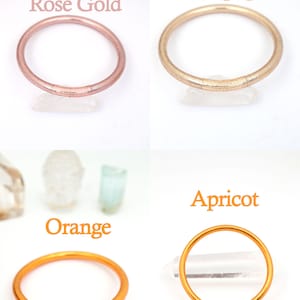 Authentic Buddhist Temple Bracelets in Gold, Rose Gold, Orange, and Apricot.