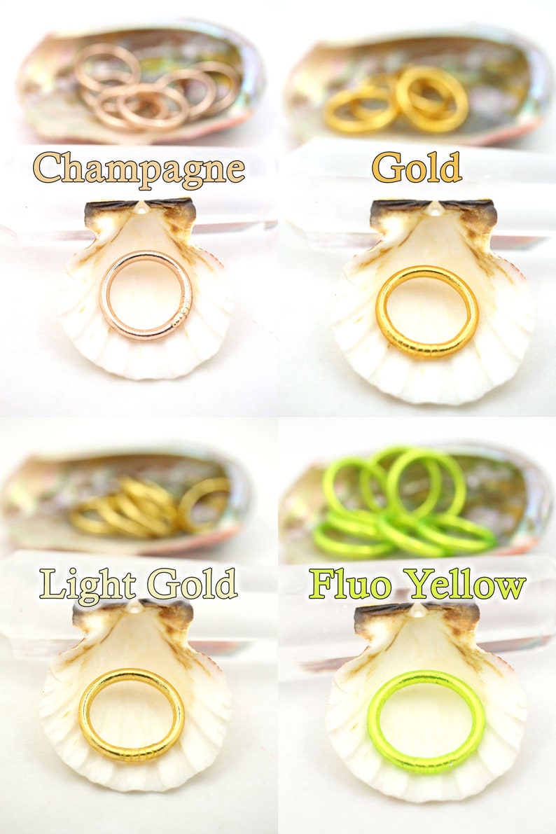 May include: Four seashells with different colored rings inside. The rings are in the colors champagne, gold, light gold, and fluo yellow.
