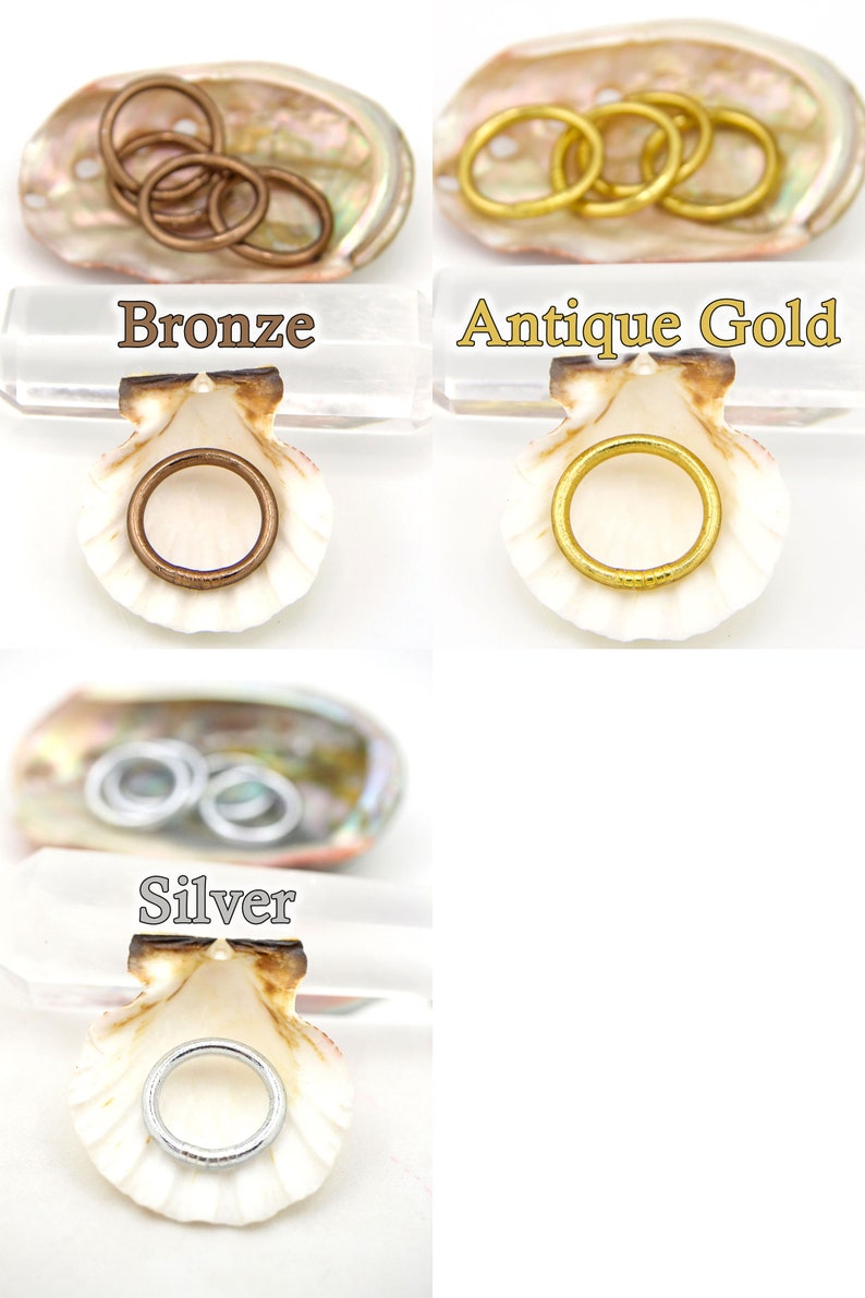 May include: Three sets of jump rings in different finishes: bronze, antique gold, and silver. Each set is displayed in a seashell.