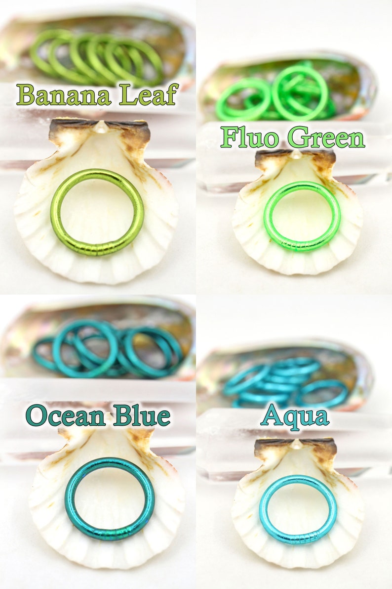 May include: Four different colored metal jump rings in a seashell. The colors are Banana Leaf, Fluo Green, Ocean Blue, and Aqua.