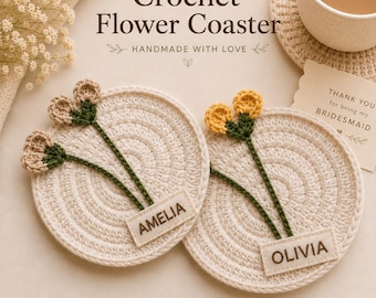 May include: Two round, cream-colored crochet coasters featuring green stems and flower buds in beige and yellow. Each coaster has a rectangular fabric tag with the names AMELIA and OLIVIA embroidered in brown. Text reads Crochet Flower Coaster.