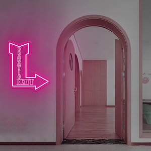 May include: A bright pink neon sign on a wall reads "DRAMATIC EXIT" in a stylized font with an arrow pointing right. The sign is mounted on a light pink wall, with an arched doorway and open doors leading to a hallway.