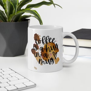 COFFEE is a mug in a hug White glossy mug