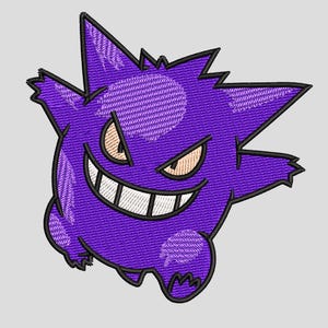 May include: Embroidered purple cartoon character with a wide grin, sharp teeth, and angry eyes. The character has spiky features and a round body. Black outlines define the character's shape, and the background is a solid light gray.