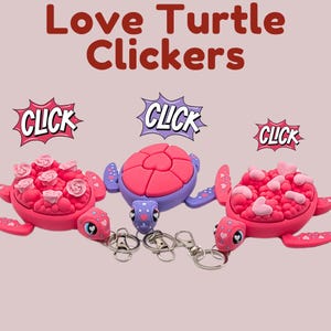 May include: Three colorful turtle-shaped clickers with keychains. The turtles are primarily pink and purple, with heart and rose details. The text "Love Turtle Clickers" is at the top, with "CLICK" speech bubbles.