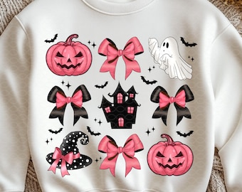 May include: White sweatshirt featuring a Halloween-themed design. The design includes pink jack-o'-lanterns, black and pink bows, a haunted house, a ghost, and a witch's hat. Black bats and stars complete the festive look.